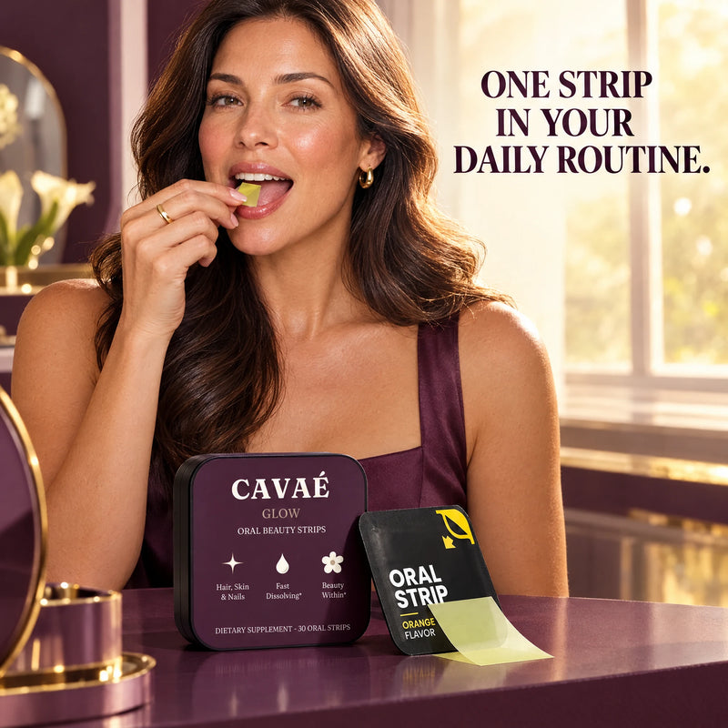 Woman placing a CAVAÉ GLOW oral strip on her tongue beside the tin and orange sachets.
