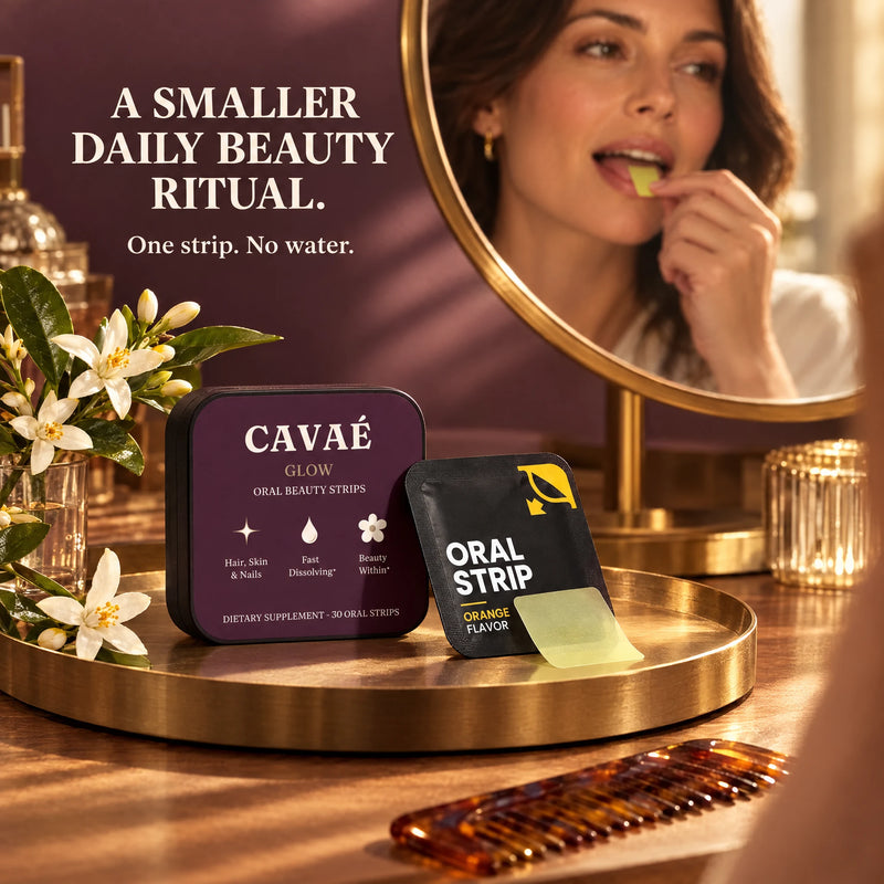 CAVAÉ GLOW tin and orange sachets on a plum vanity beside a mirror and sliced orange.